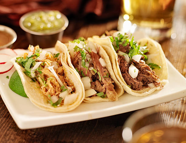 istock Mexican barbacoa with carnitas and chicken tacos 186343040