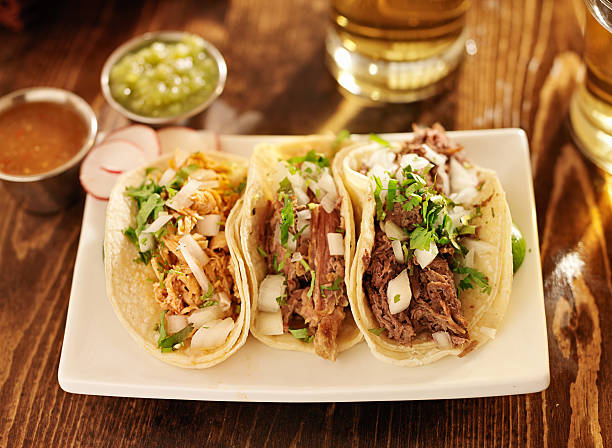 istock authentic mexican barbacoa, carnitas and chicken tacos 186343049