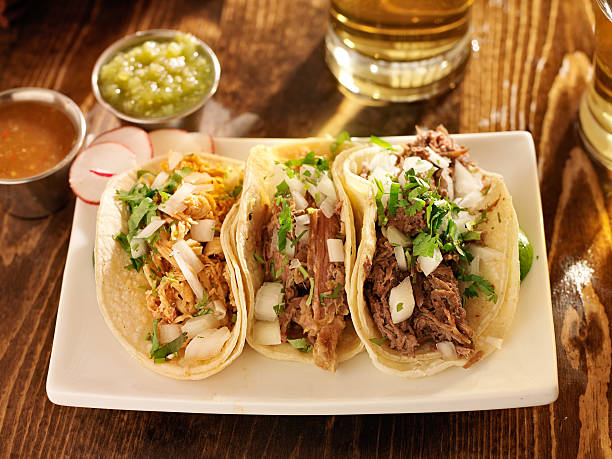 istock authentic mexican barbacoa, carnitas and chicken tacos 186343055