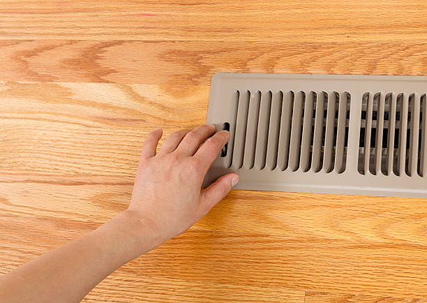 istock Opening up Floor Vent Heater 186343814