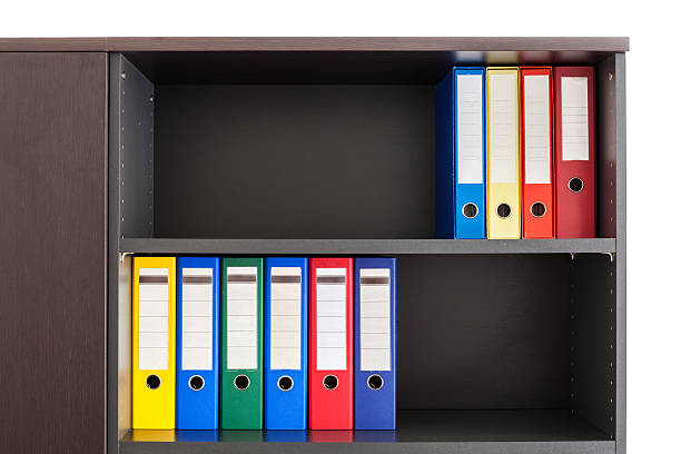 istock Red, green, blue and yellow office ring binders in boxes 186344235