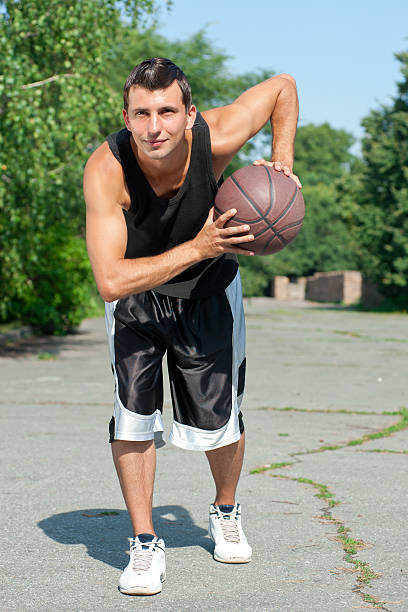 istock Young basketball player with ball 186344390