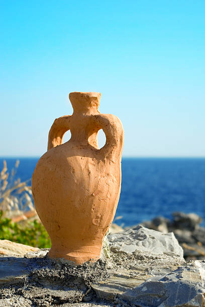 Greek amphora over the sea stock photo