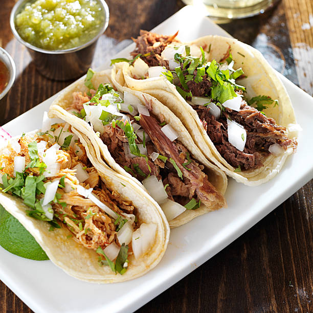 istock authentic mexican barbacoa, carnitas and chicken tacos 186347699