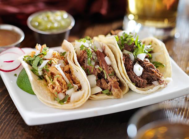 istock authentic mexican barbacoa, carnitas and chicken tacos 186347741