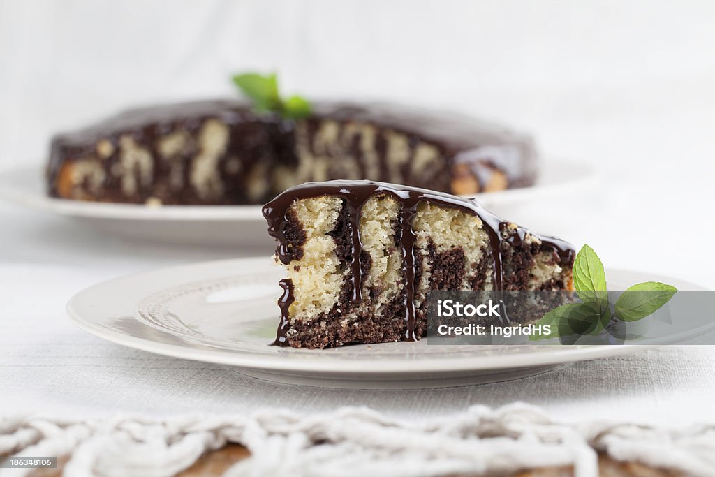 Zebra marble cake with chocolate glaze Zebra marble cake with chocolate glaze. Shallow dof,  Backgrounds Stock Photo