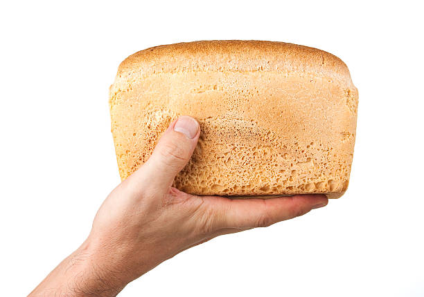istock loaf of bread in his hand 186348787
