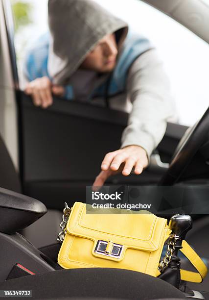 Thief Stealing Bag From The Car Stock Photo - Download Image Now - Car, Stealing - Crime, Adult