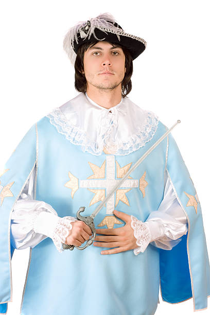 istock man with a sword dressed as musketeer 186349856