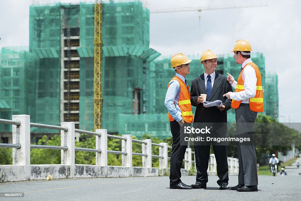 During the break Copy-spaced image of modern engineers discussing something outside Adult Stock Photo