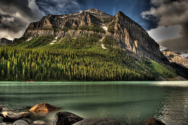 Scenic moutains with lake in HDR, Rocky Mountains, Alberta, Canada stock photo