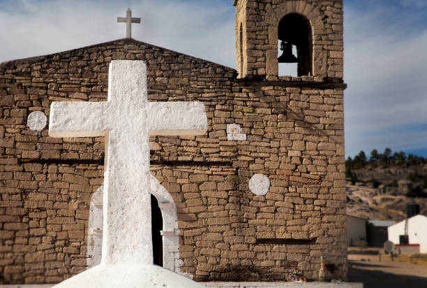 istock A crucifix and a church 1863585934