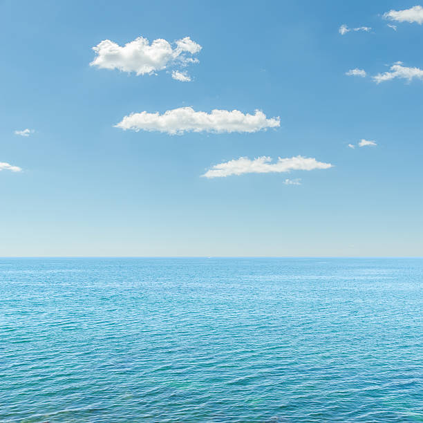 istock blue sea and cloudy sky over it 186361126