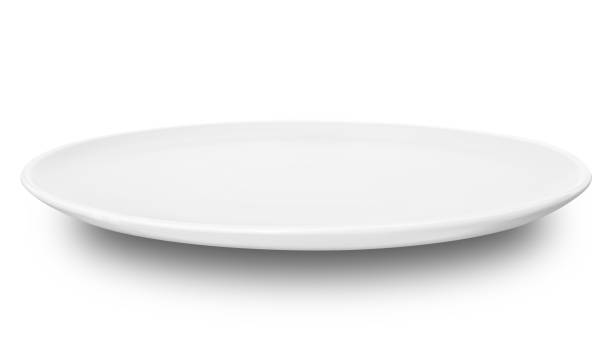 istock White circle ceramics plate isolated on white background. 1863611500
