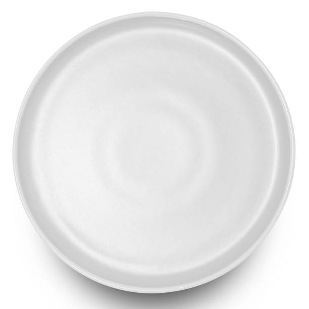 istock White circle ceramics plate isolated on white background. 1863612004