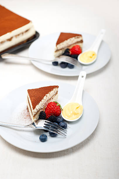 istock tiramisu dessert with berries and cream 186361357