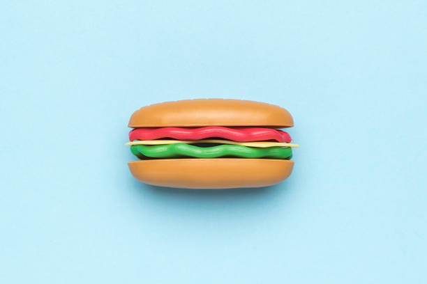 istock A hot dog figurine on a light blue background. 1863625219