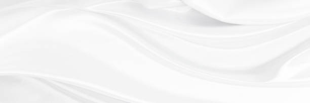 istock White gray satin texture that is white silver fabric silk background with beautiful soft blur pattern natural. 1863681738