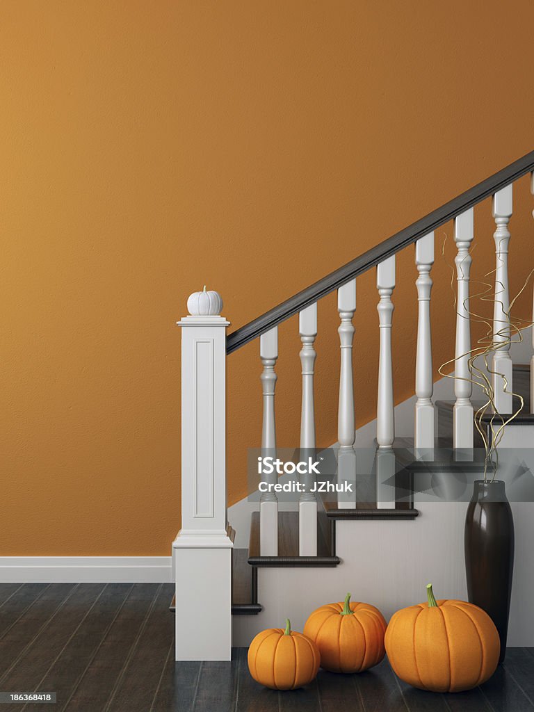 Stairs with a festive decoration Colorful composition with classical staircase, which decorated for Halloween and posted on the background of bright orange wall Autumn Stock Photo