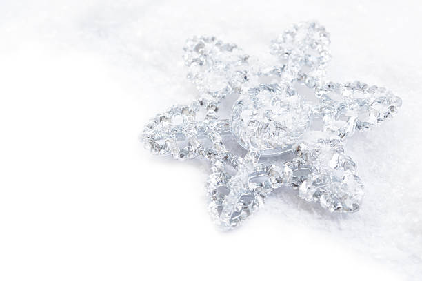istock snowflake decoration in white snow isolated 186368675