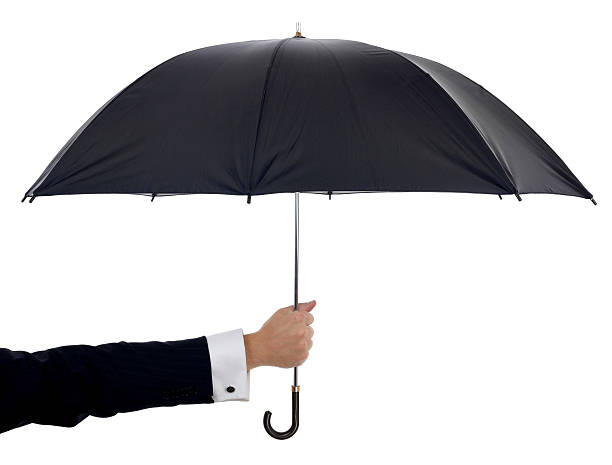 istock A black umbrella on a white background upheld by one arm 186368794