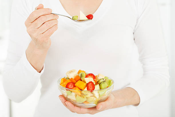 istock Fruit salad in women hands. 186369119