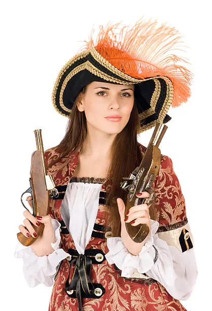 Nice young woman with guns dressed as pirates