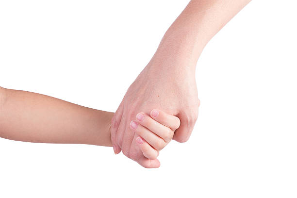 istock Mother holding a hand of her son 186377309
