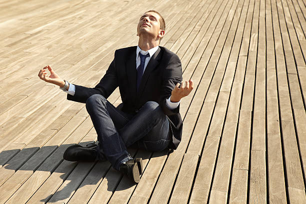 istock Young businessman in the lotus position. 186377347