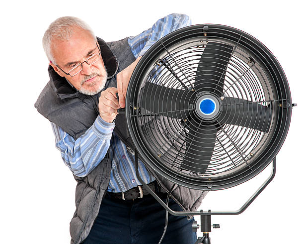 istock man repairing fan 186377632