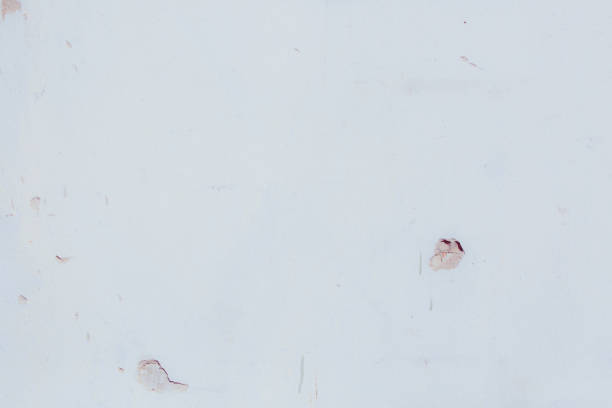 istock White plaster wall with deep scratches and chips. Various variations of abrasions. 1863793180