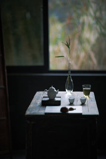 Image of woman making tea, Asian tea style, tea set
