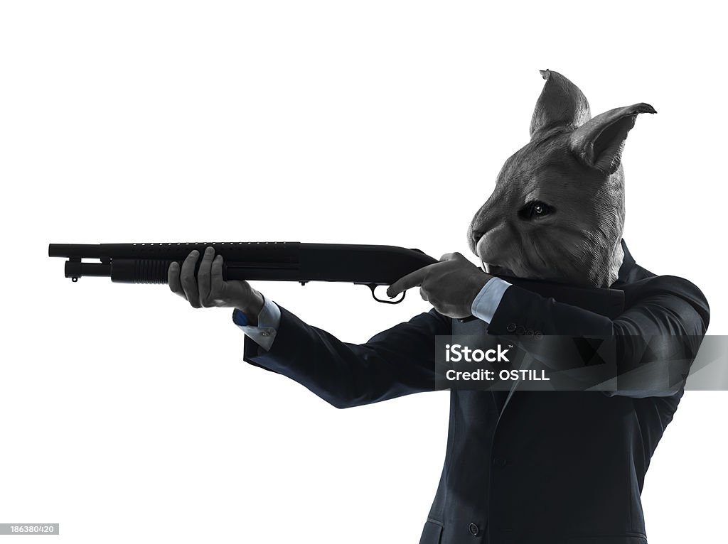 Hombre usando la máscara de conejo caza con escopeta Silueta de Retratos - Foto de stock de Arma libre de derechos