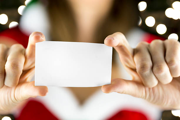 istock Miss Santa holding blank card 186380676