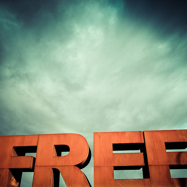 istock Capital letters FREE with cloudy sky 186381043