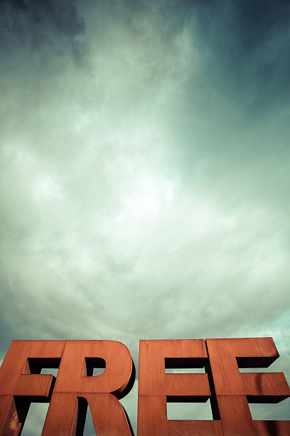 istock Capital letters FREE with cloudy sky 186381051