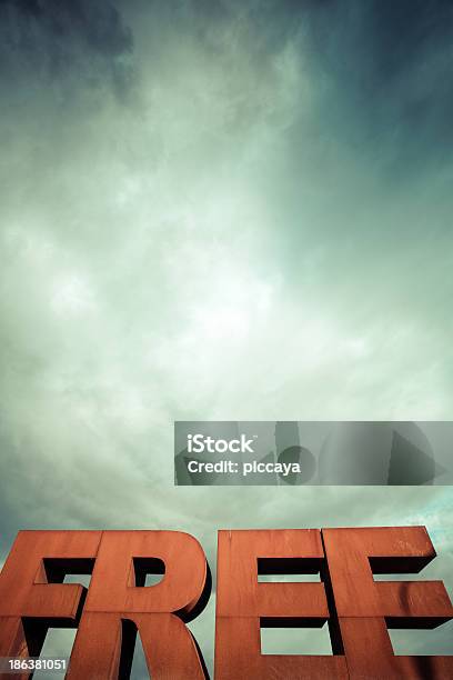 Capital Letters Free With Cloudy Sky Stock Photo - Download Image Now - Advertisement, Alphabet, Blue