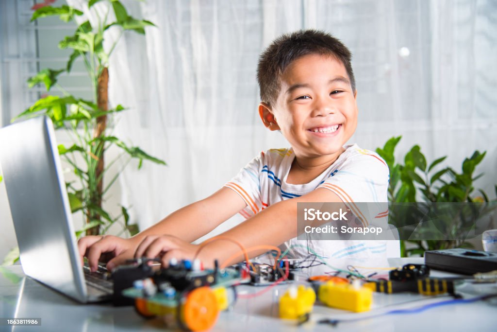 Asian Kid Boy Learns Coding And Programming With Laptop For Opensource ...