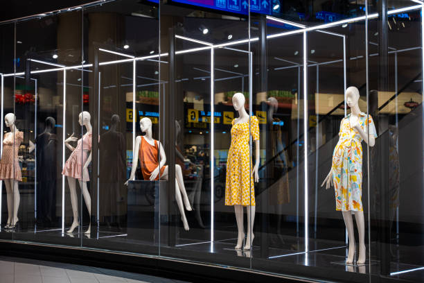 istock Colorful and artistic mannequins in a store display case 1863812512