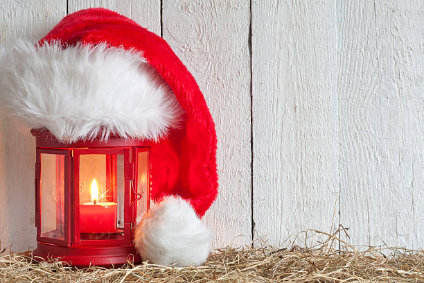 istock Christmas lantern with Santa Claus hat 186381581