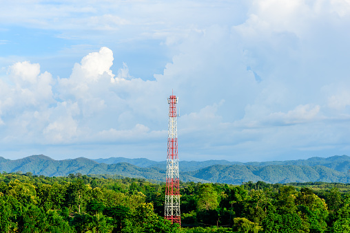 Cell phone antenna tower with blue sky background