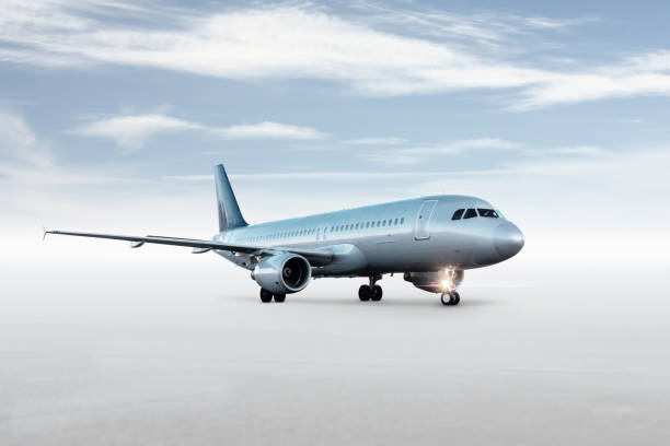 istock Passenger airplane isolated on bright background with sky 1863839575
