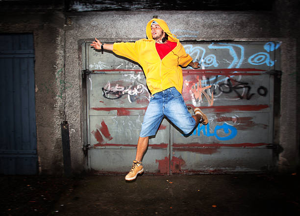 istock Young man jumping on grunge wall 186387917