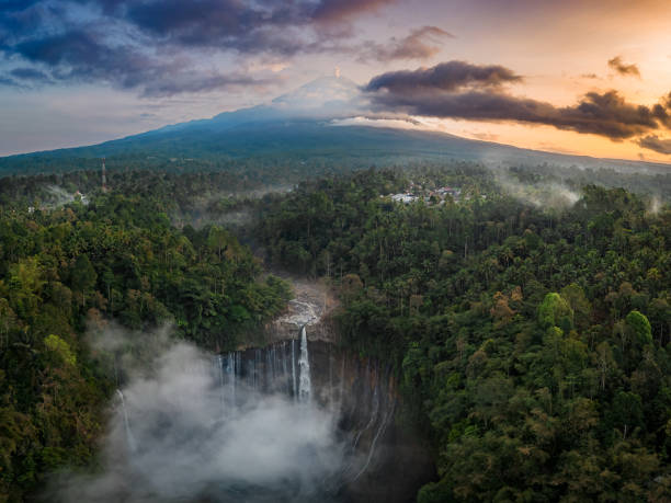 Tumpak Sewu Waterfall Aerial view of Tumpak Sewu Waterfall and Mount Semeru at sunrise located in East Java, Lumajang, Indonesia. Natural landscape background. bromo tengger semeru national park stock pictures, royalty-free photos & images