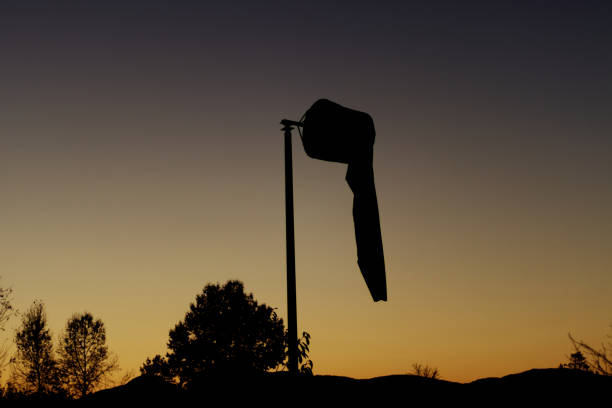 flag of Finland over the Gulf of Bothnia on the background of sunset