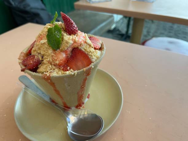 istock Cheese cake with strawberry slice and biscuit crumble 1863906157
