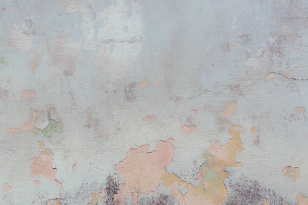 Free space for an inscription. Can be used as a background or poster. Fragment of a wall with bumps and peeling paint.