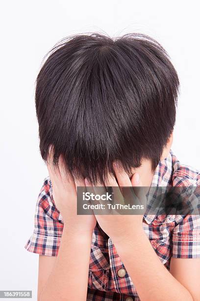 Young Little Boy Crying Or Playing With Hiding Face Stock Photo - Download Image Now