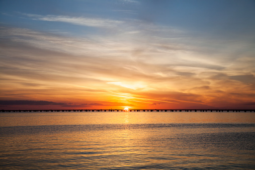 A colorful sunset featuring the Lake Pontchartrain Causeway in Louisiana