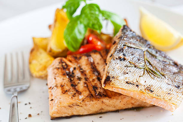 istock Grilled salmon filet with baked potatoes 186396106